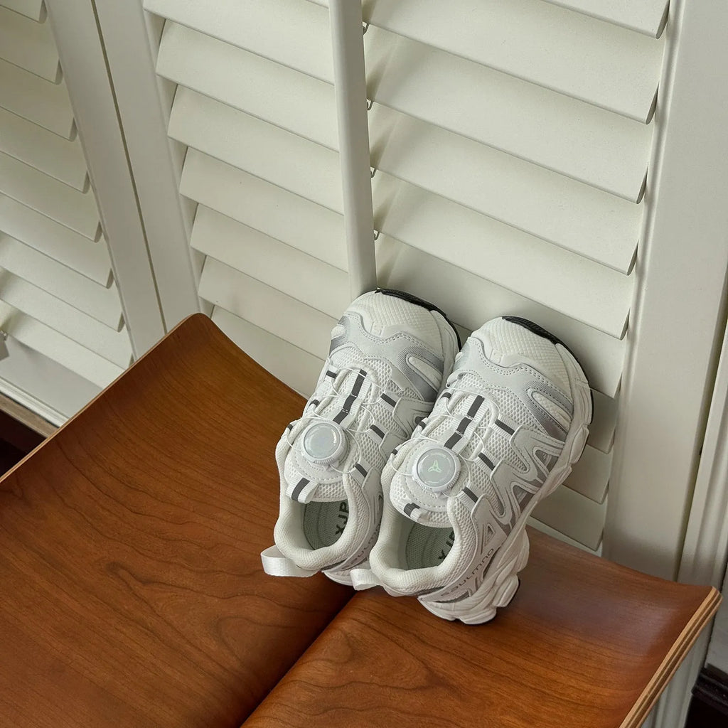 Girls' lightweight casual flats in black, beige, or pink with a breathable mesh upper.