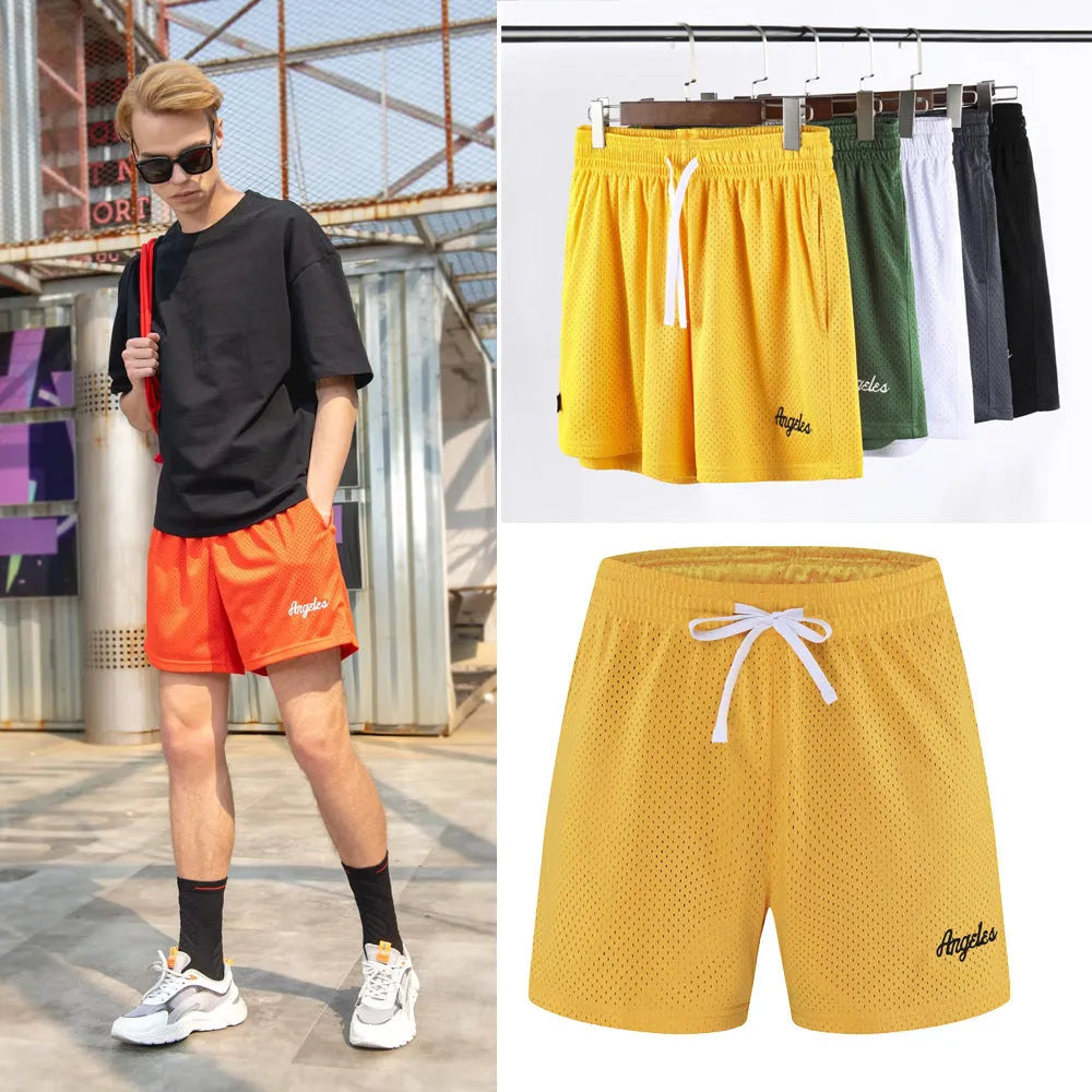 Men's double-layer mesh shorts in sports purple, showing the textured fabric and sporty design.