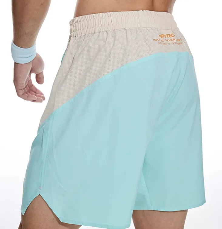 Men's loose fit workout shorts in polyester-spandex blend with elastic lace-up waist