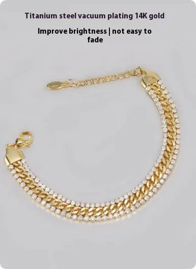 Gold tennis bracelet with titanium steel construction and artificial gemstone inlay on wrist