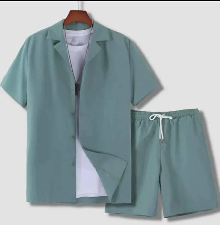 Man wearing a light blue short sleeve Cuban collar shirt and matching shorts from a men's sport suit set.