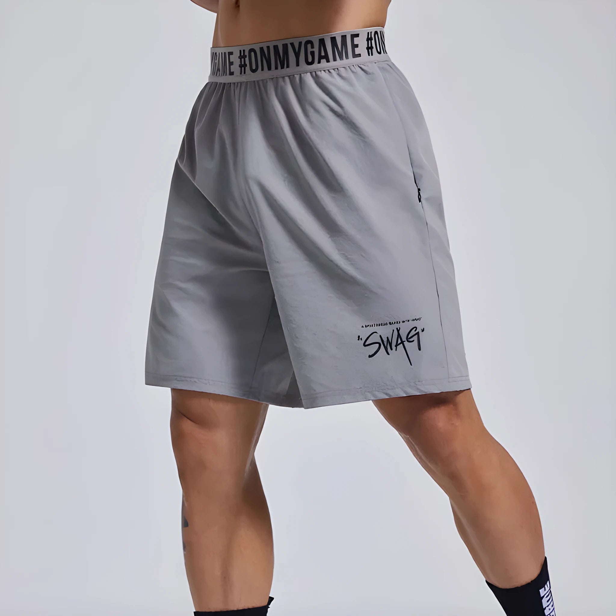 Men's loose black sports shorts with elastic waistband and letter detailing, shown front view.
