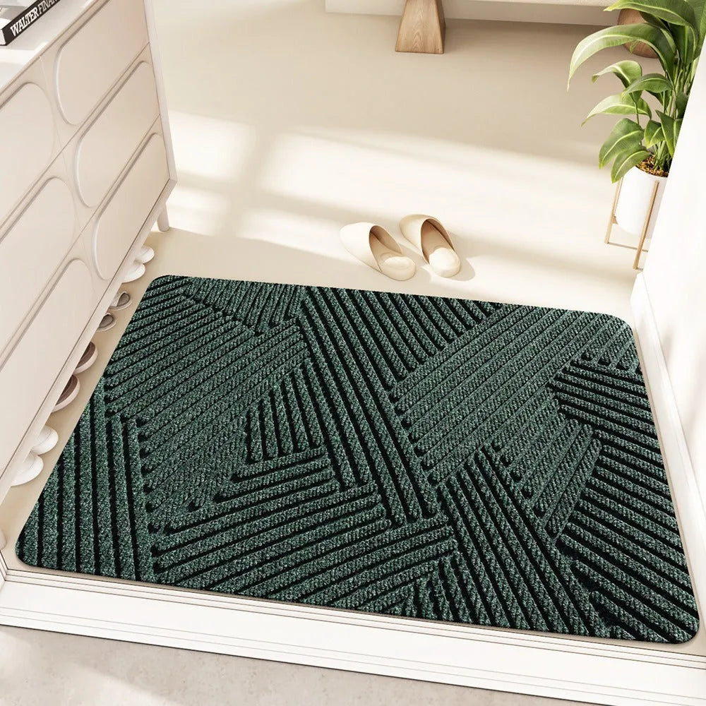 Green cartoon anime alien shaped silk ring entrance carpet measuring 60x90cm on a floor.