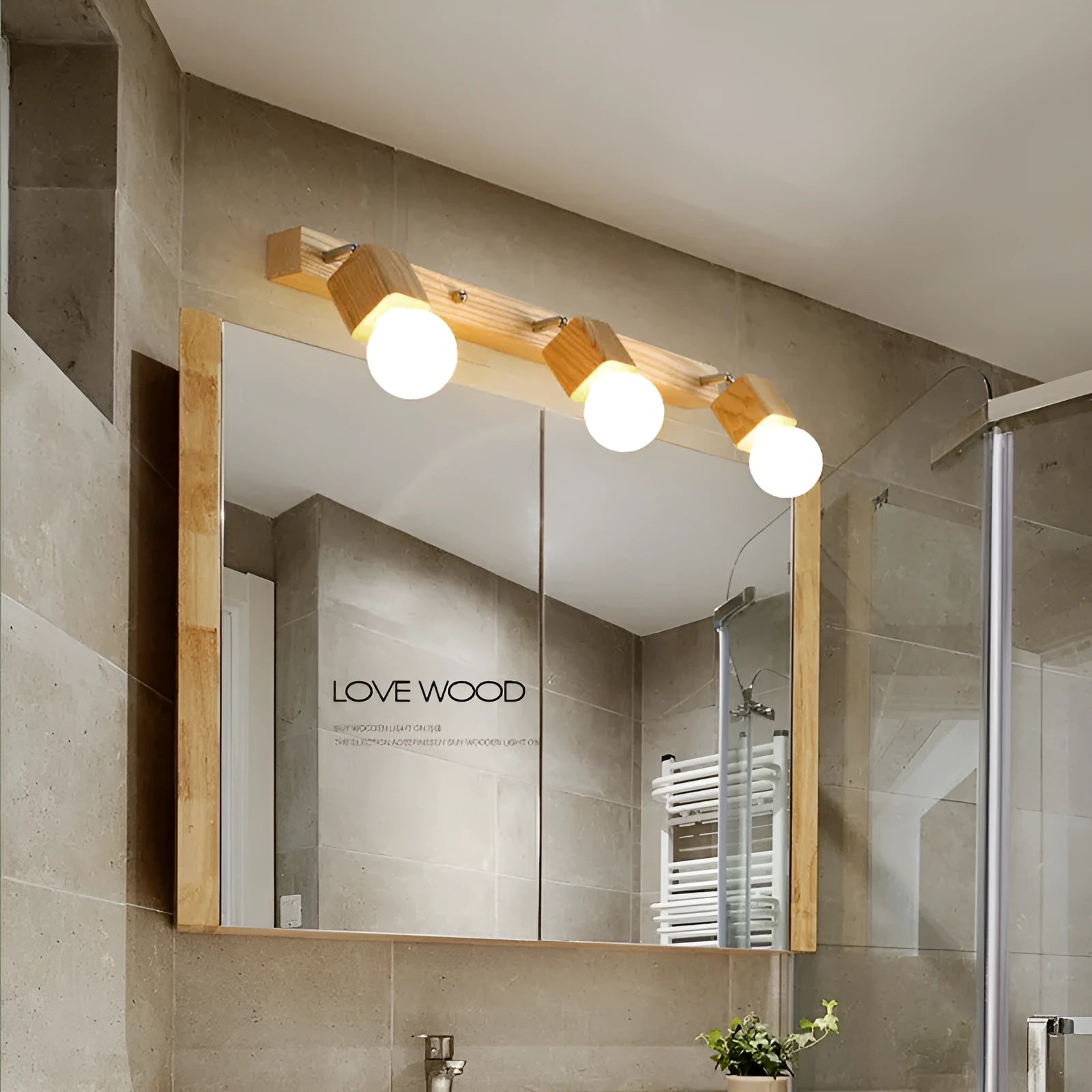 Round 24cm mirror finish LED wall lamp mounted on a wall