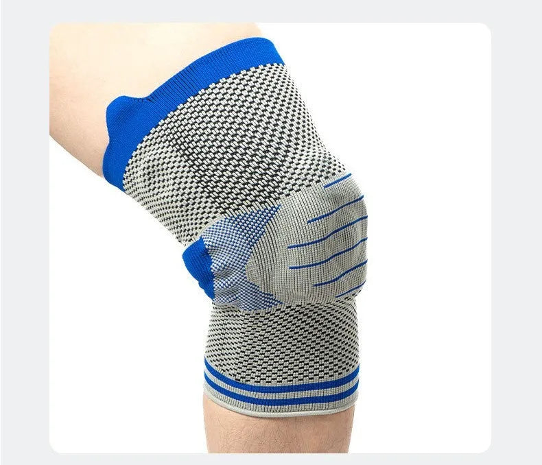 Silicone massage spring bar shock absorber knee pad in black and blue colour, shown with cotton material and sizing tag.