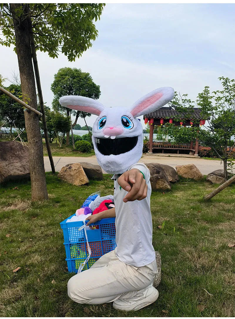 White decorative rabbit head plush cover for an electric motorcycle helmet.