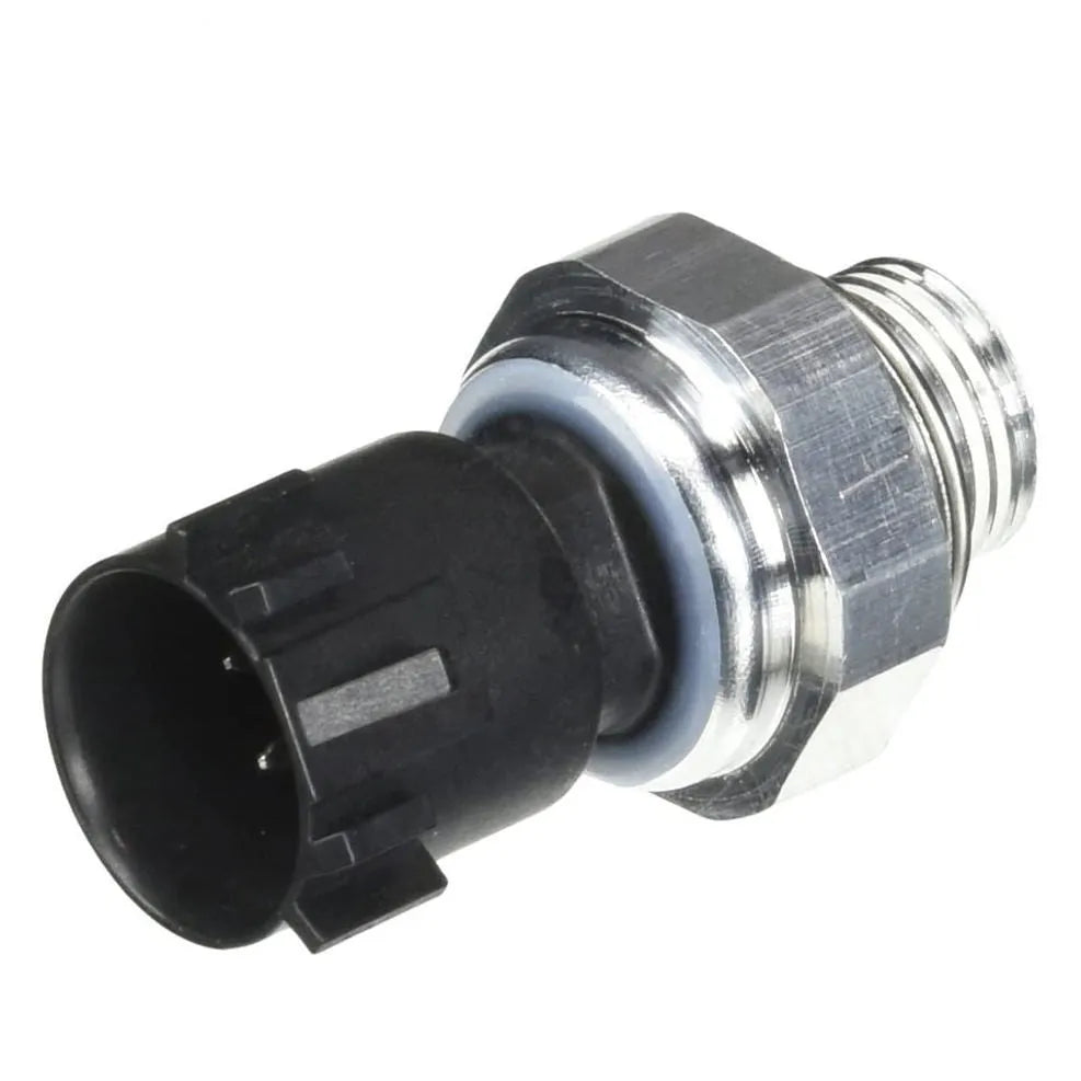 Silver automobile fuel pressure sensor with electrical connector isolated on white background.