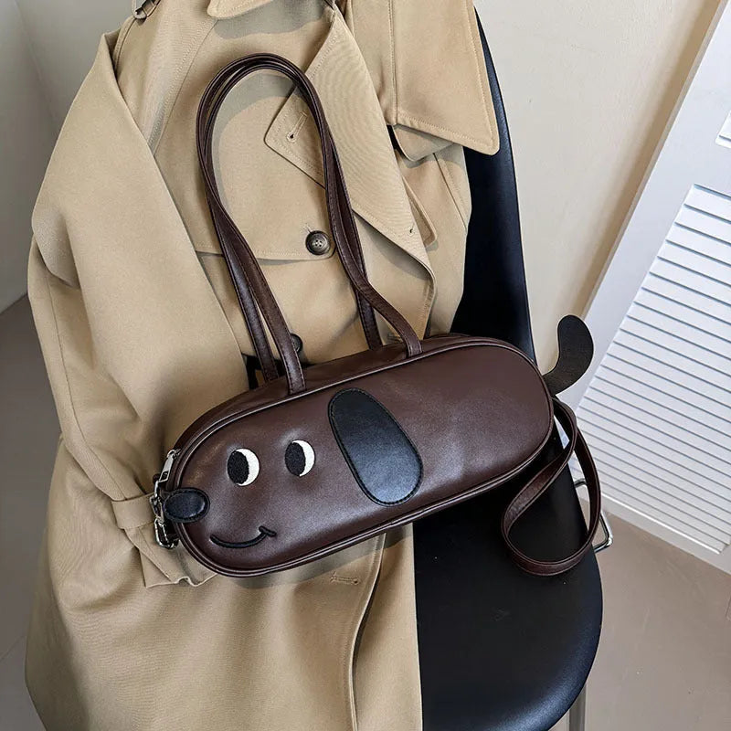 Sausage dog crossbody bag in coffee brown matte finish with single shoulder strap and horizontal shape