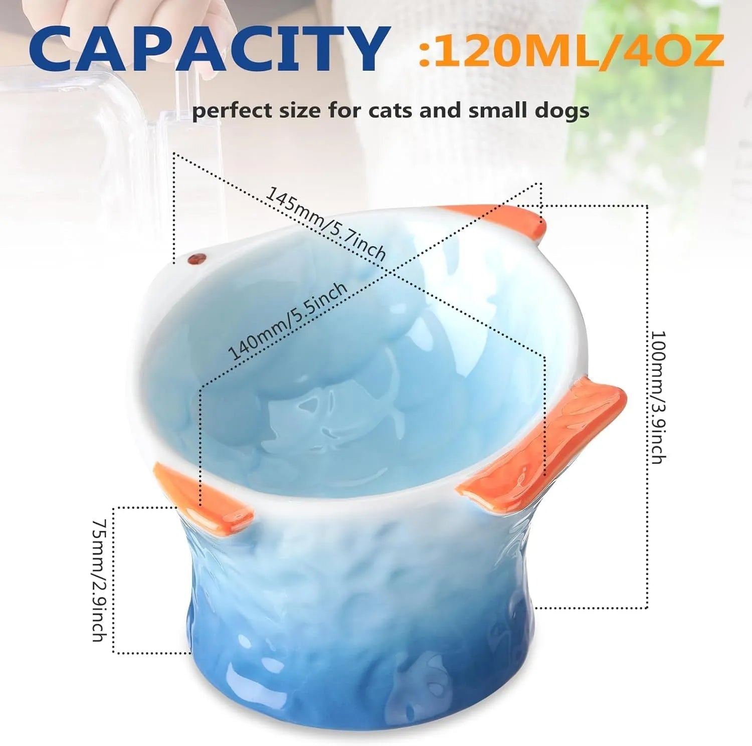 Blue fish-shaped ceramic cat bowl with tilted design on a wooden surface.