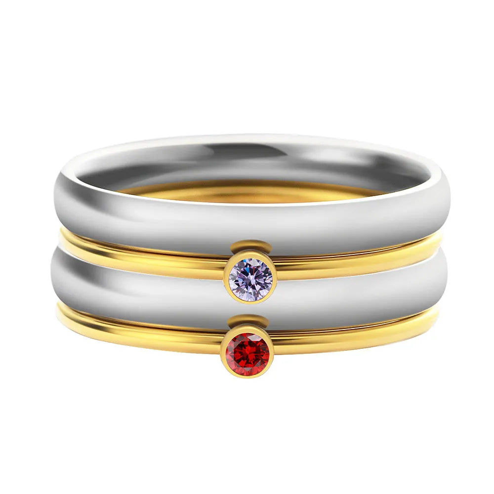 Geometrical titanium steel ring for women with December birthstone colour and superimposed engraving pattern.