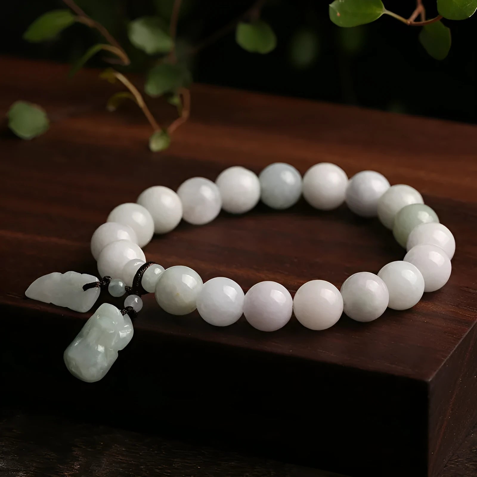 Natural emerald jade bracelet with hanging Maitreya Buddha charm and geometric design