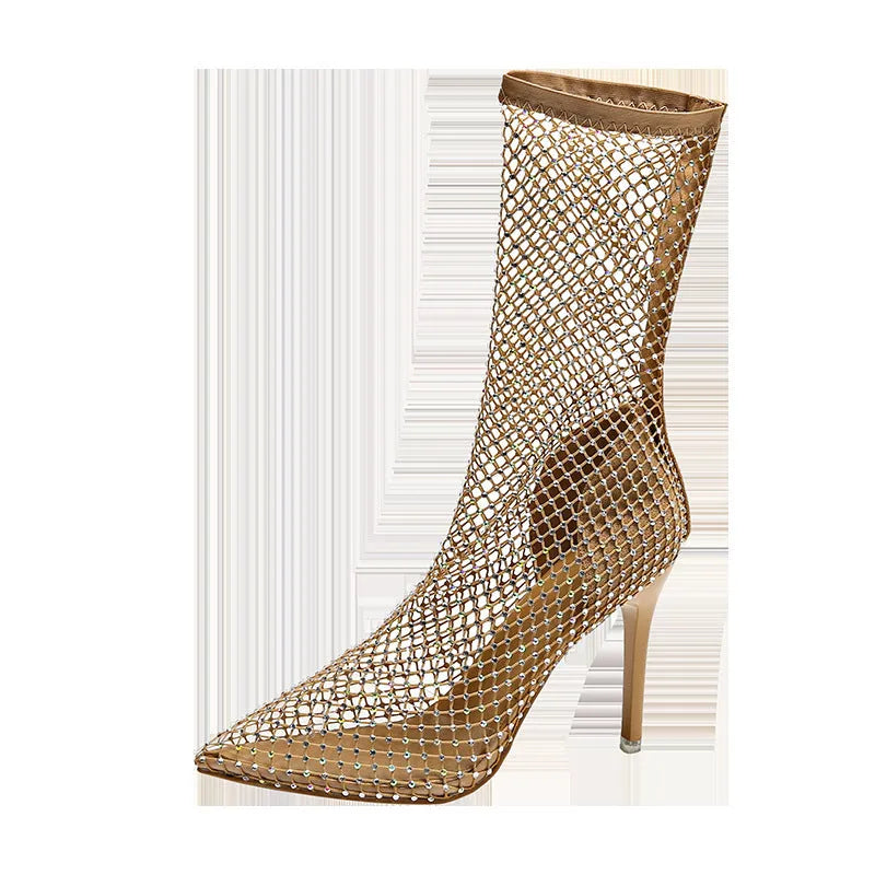 Gold high heel sandals with mesh upper, pointed stiletto toe, and an oversleeve design.