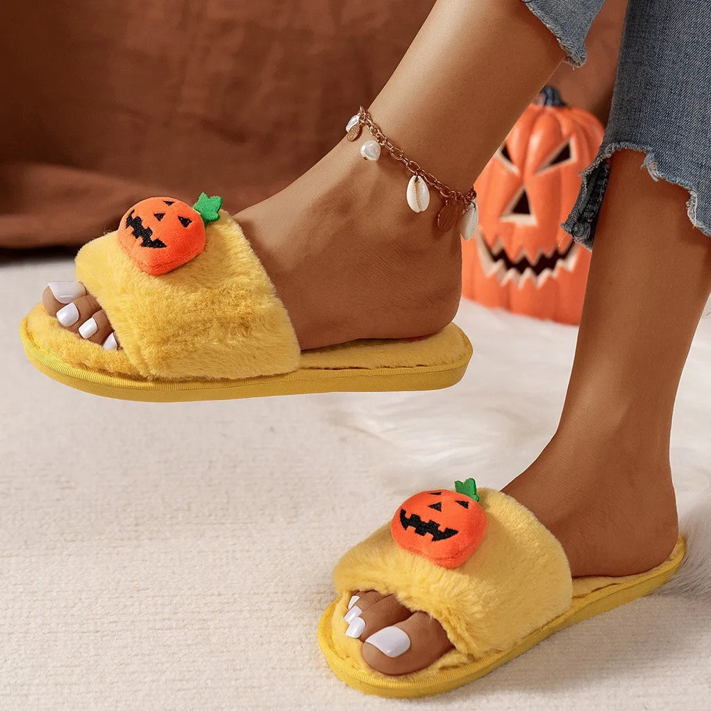 Halloween pumpkin plush slippers with open toe design in yellow colour showing synthetic fur and anti-slip soles