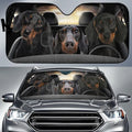 Car front snow protection cover made from silver aluminum foam fabric with black lanyard ties.