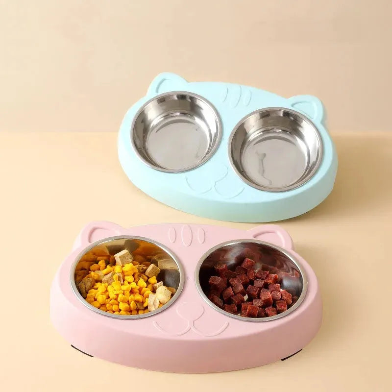 Blue macaron-shaped plastic pet feeder with two separate bowls for food and water.