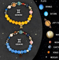 Set of twelve zodiac sign bracelets with natural stone beads, showing two matching bracelets per astrological style.