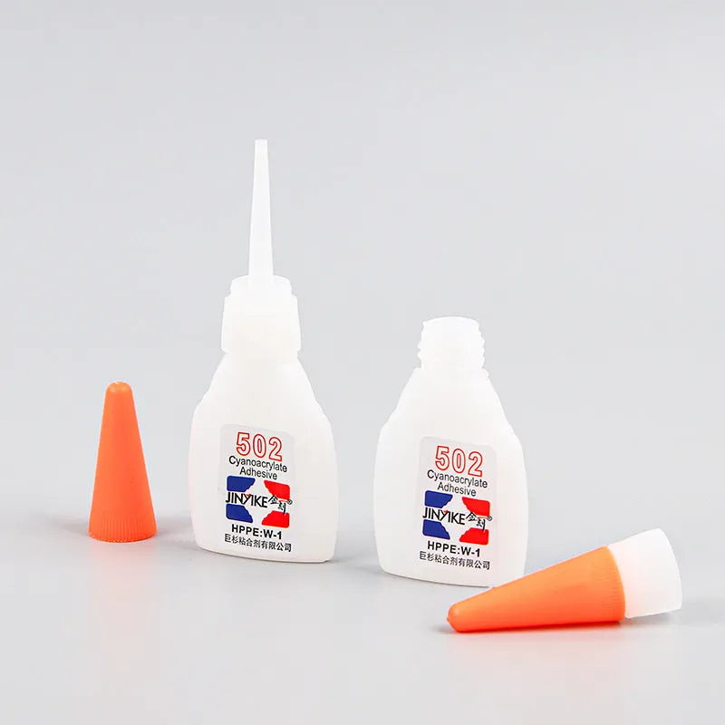 Tube of specialised shoe repair glue for strong, permanent adhesive patches on footwear.