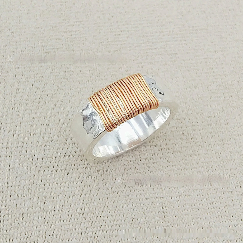 Copper geometric simple bracelet with silver gold coil finish and wide ring design.
