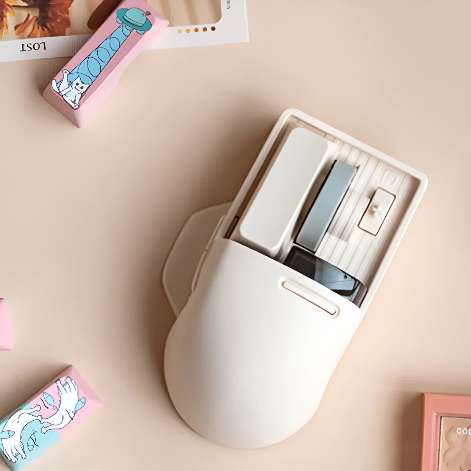 Xiaoqiao tofu colour wireless ergonomic mouse with USB receiver on a desk