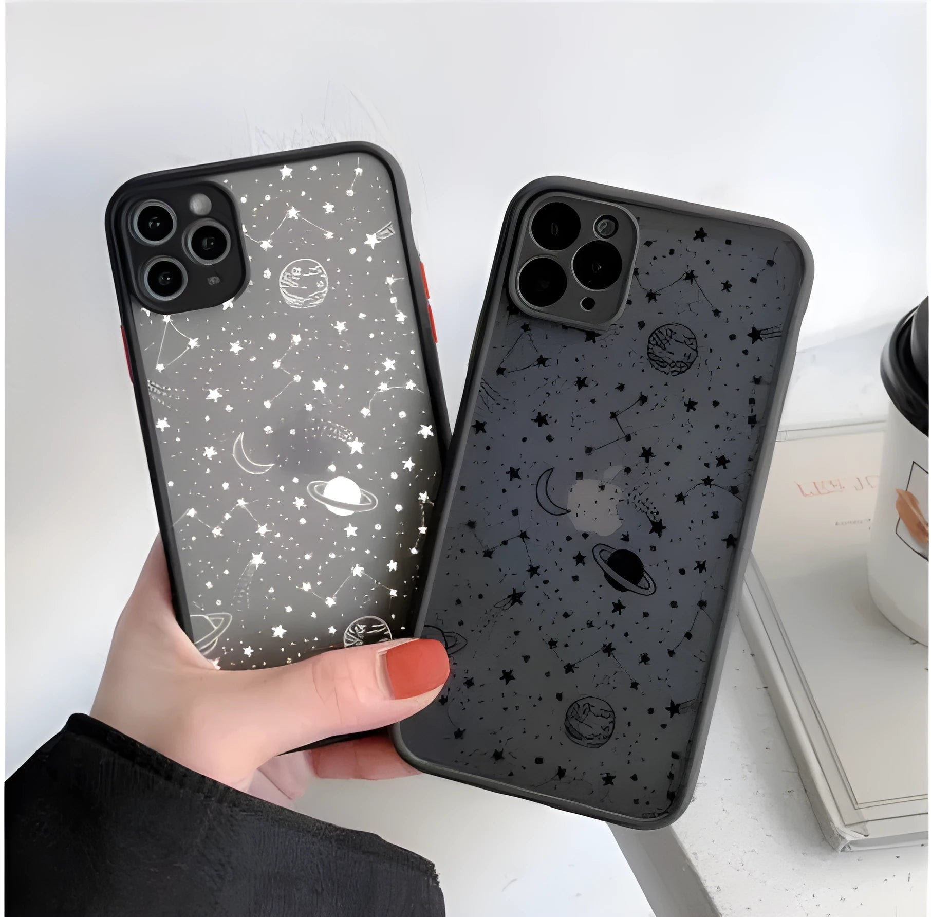 Black and white iPhone cases with soft touch surface showing raised edge protection