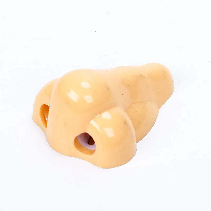 Flesh colour plastic pencil sharpener with large nostril opening for students