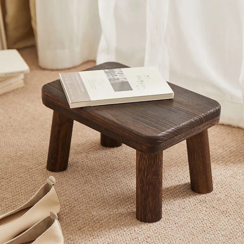 Wooden shoe changing stool with distressed finish and bracket leg structure