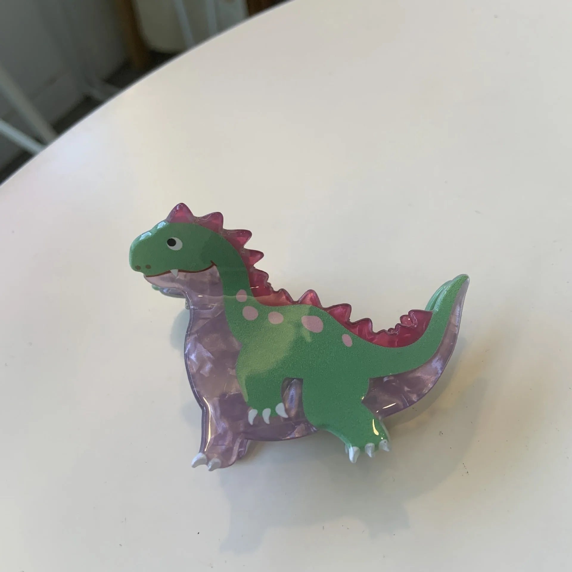 Acrylic dinosaur hair clip with jaw grip closure in one of six colourful designs