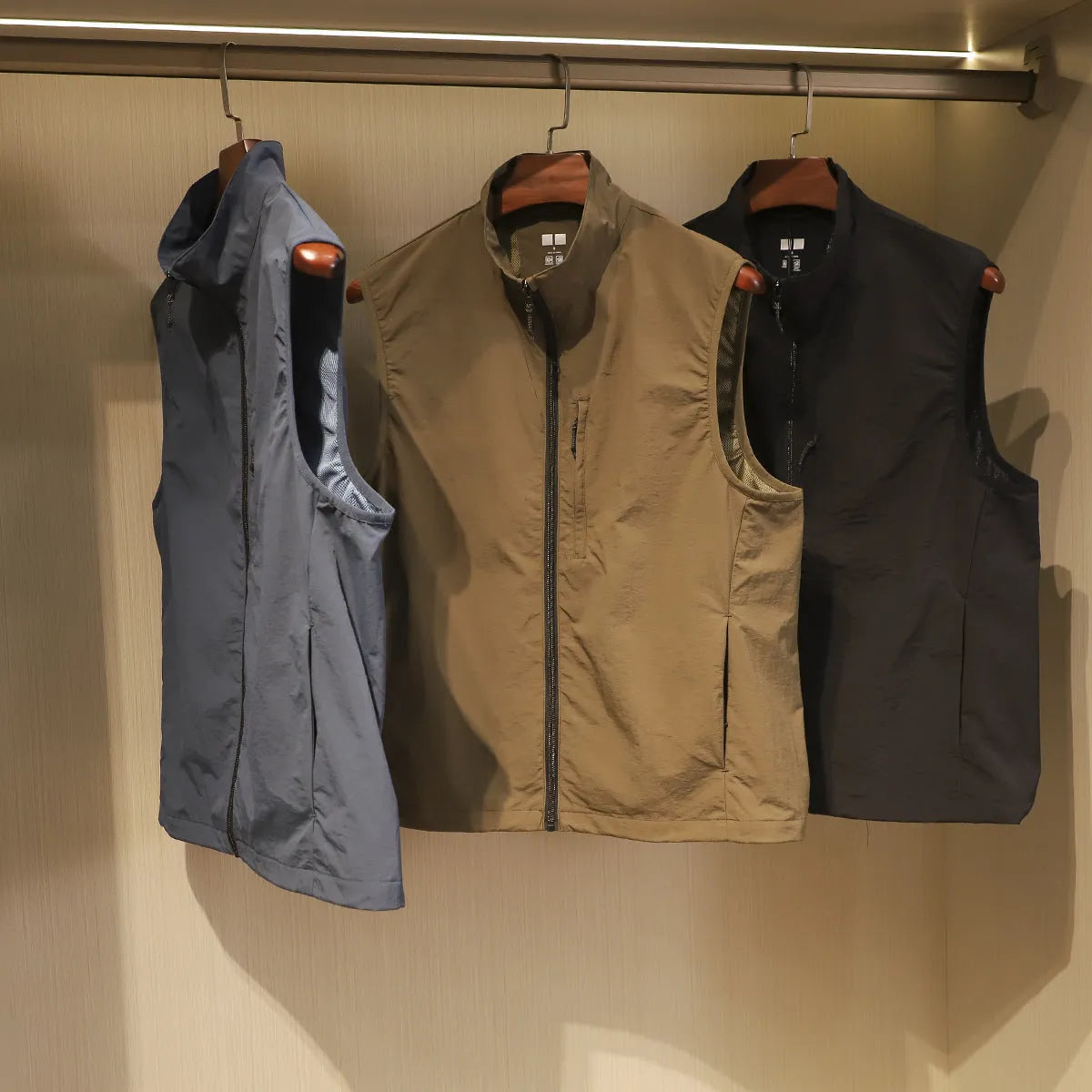 Men's black quick-drying retro bandage vest cardigan with side pocket, shown on a hanger.