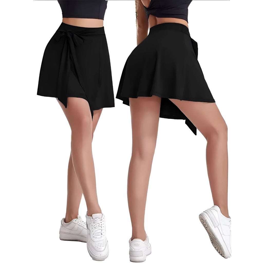 Black thigh-length sports skirt with built-in shorts, showing high waist and culotte style.