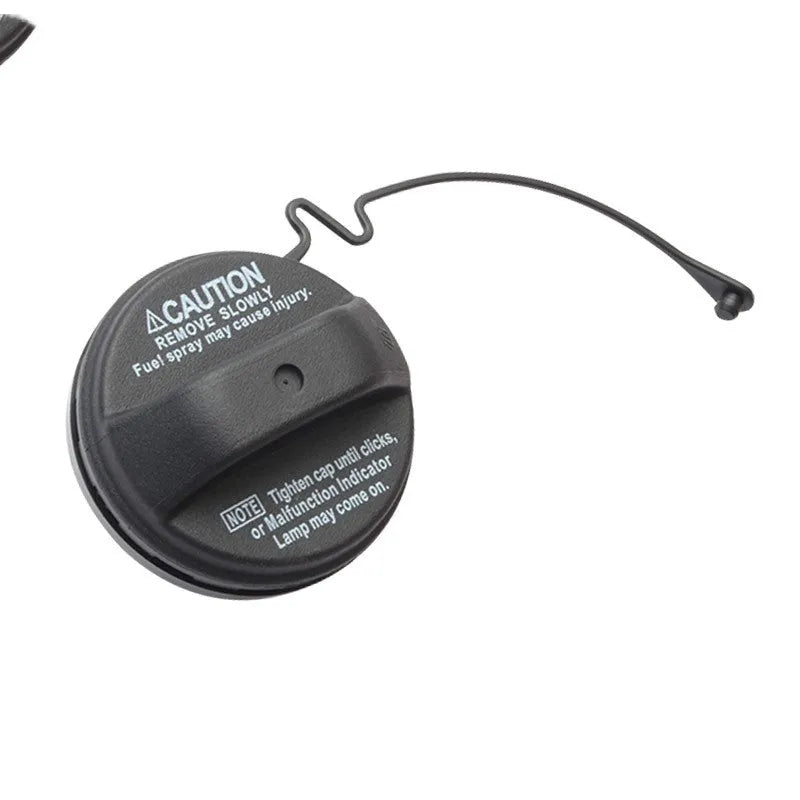 Toyota replacement snap-in fuel tank cap showing black plastic construction