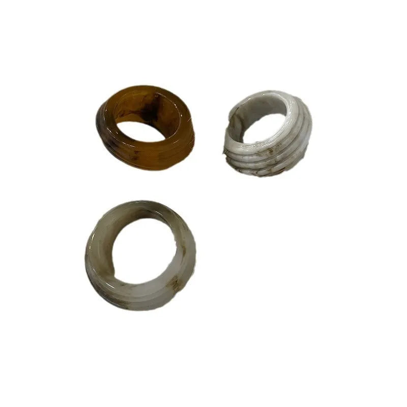 Chinese style irregular geometric resin wide ring in brown and white colours.