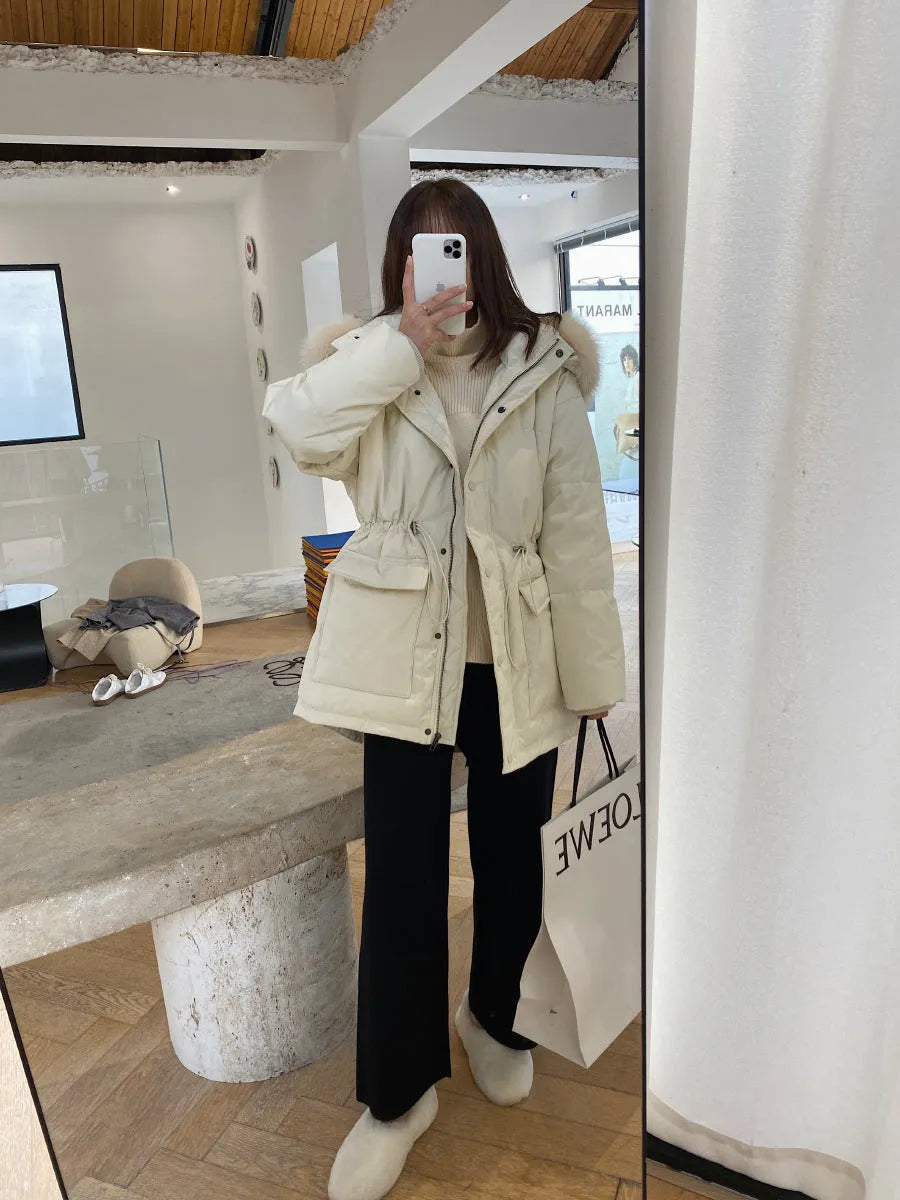 Women's cream white knitted wide-leg high-waist trousers laid flat, showing long straight-leg mopping style.