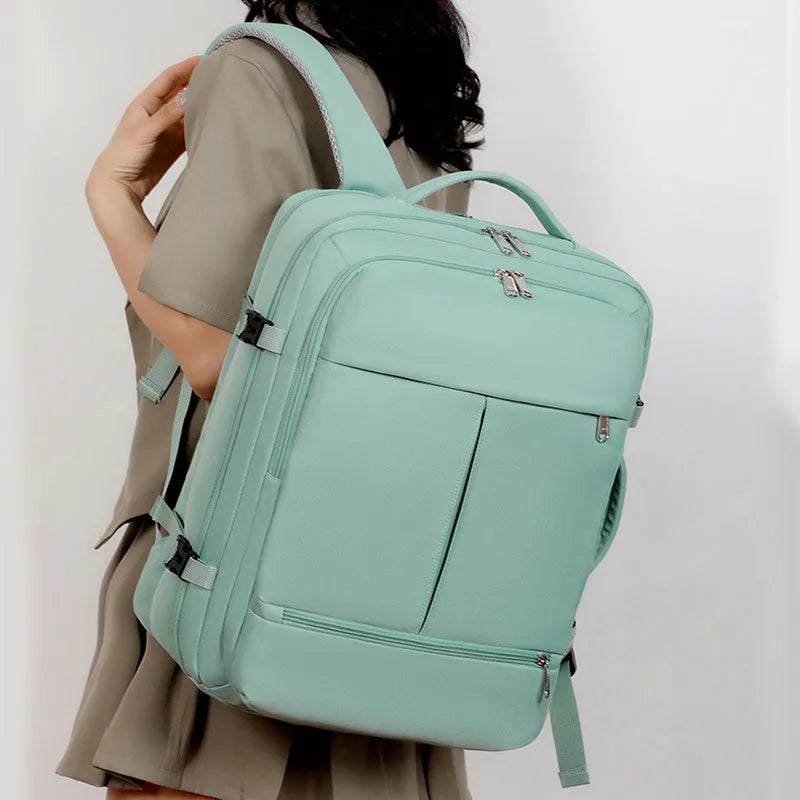 Large waterproof Oxford cloth backpack for 15.6 inch laptops, shown in multiple colours.