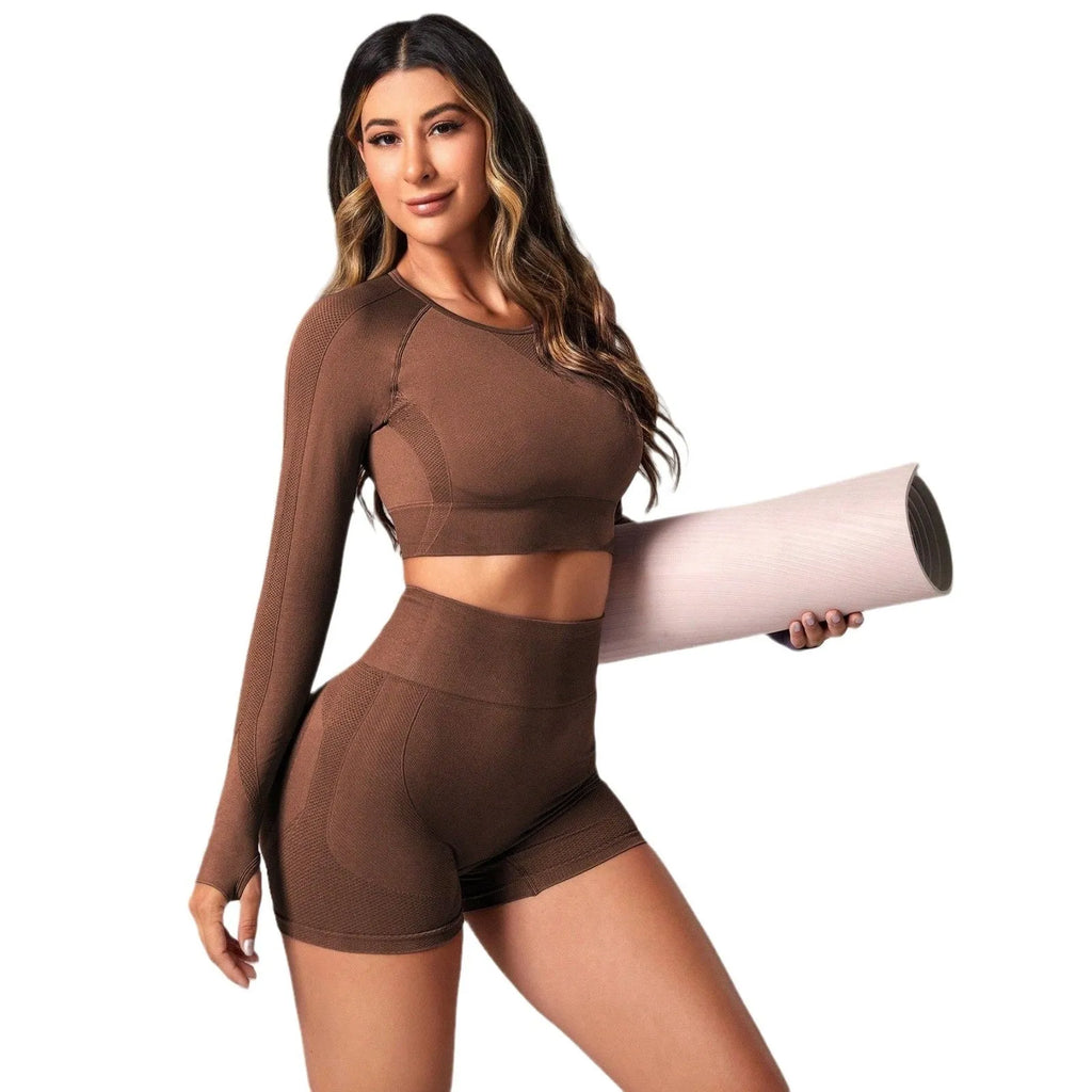 Women's black yoga clothing set with long sleeve top and high-waisted leggings