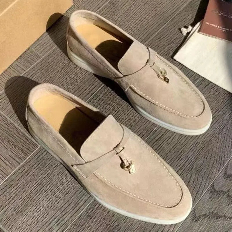 Casual slip-on Gommino loafers in black with round toe, rubber sole, and high-top design.