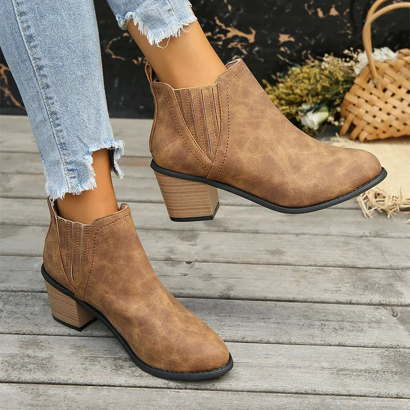 Women's black pointed toe ankle boots with thick square low heel slip-on design