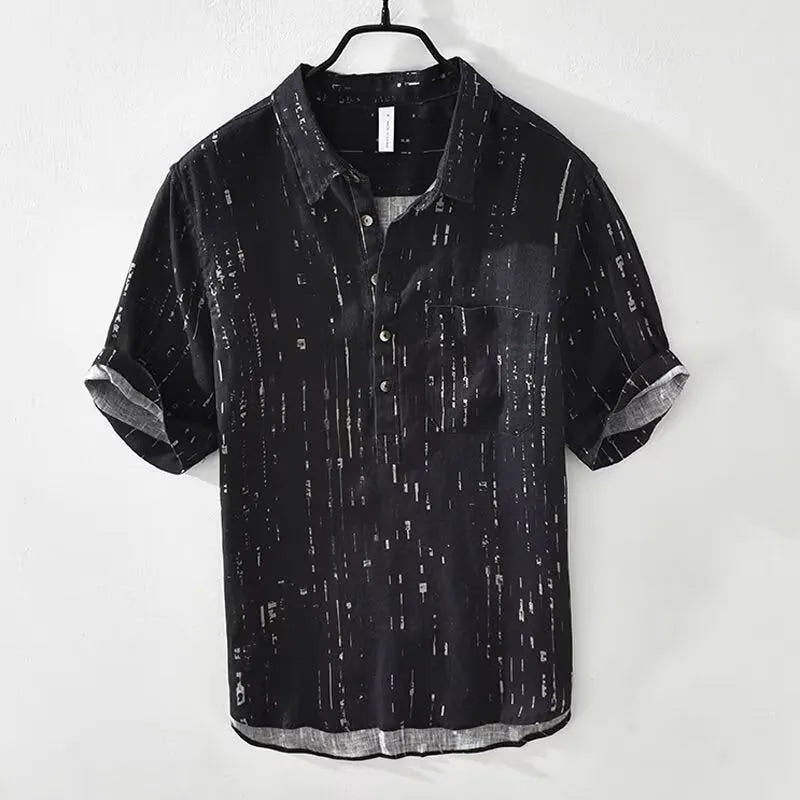 Men's loose fit short-sleeved polo shirt with lapel collar in black, laid flat.