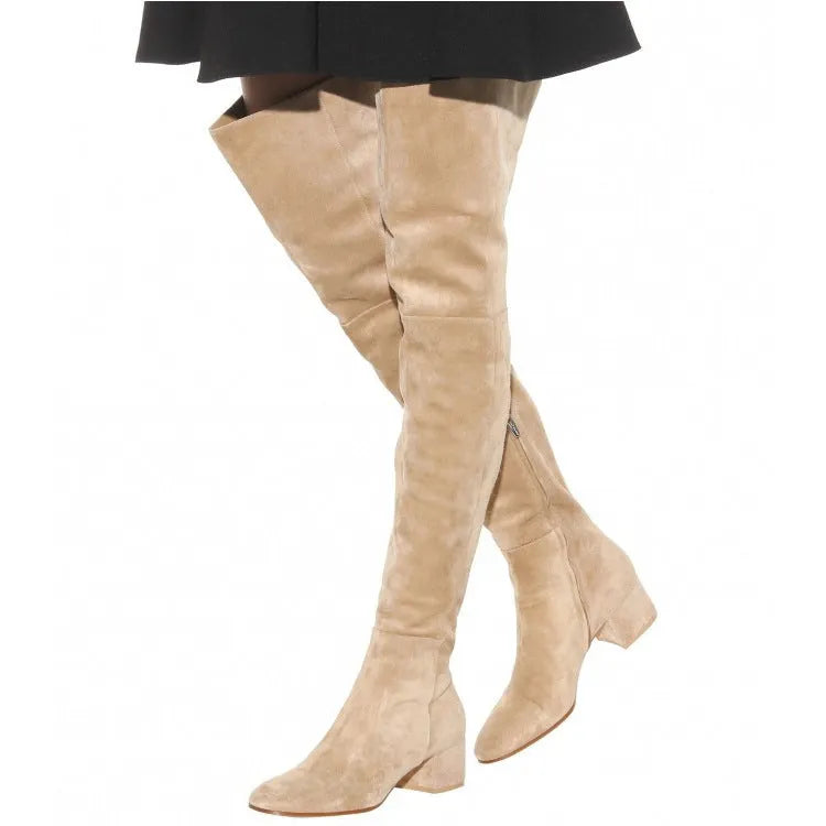 Grey women's suede over the knee flat boots with a chunky rubber sole and pointed toe.