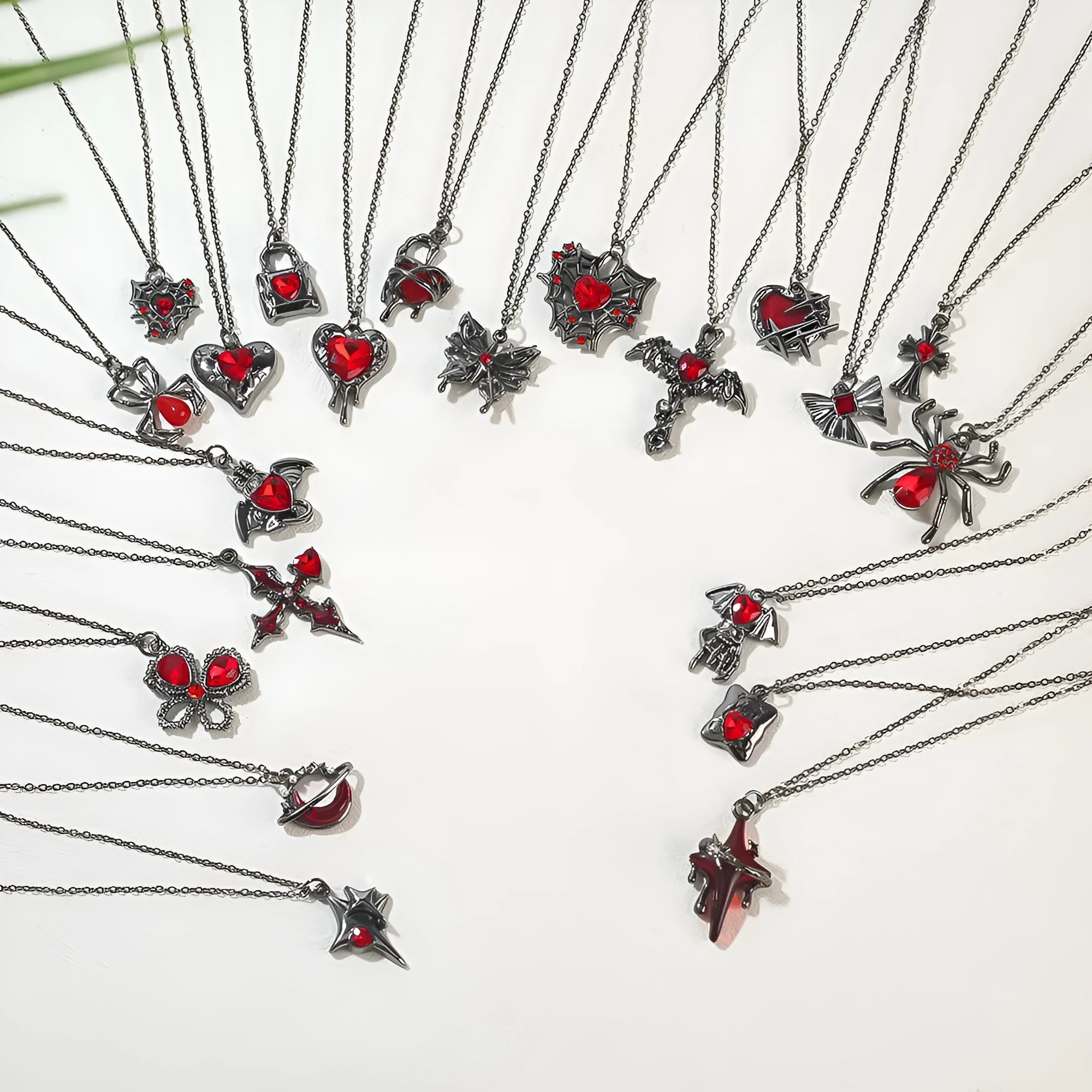 Women's zinc alloy Halloween necklace showing spider, bat, and skull wing pendant designs on a regular chain.