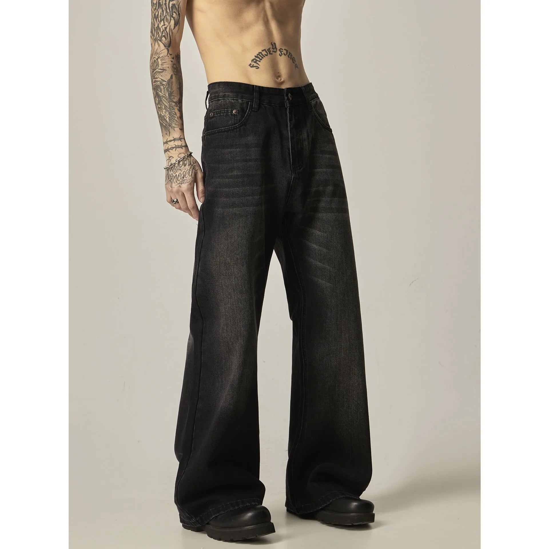 Black loose straight-leg retro jeans with zipper fly on mannequin