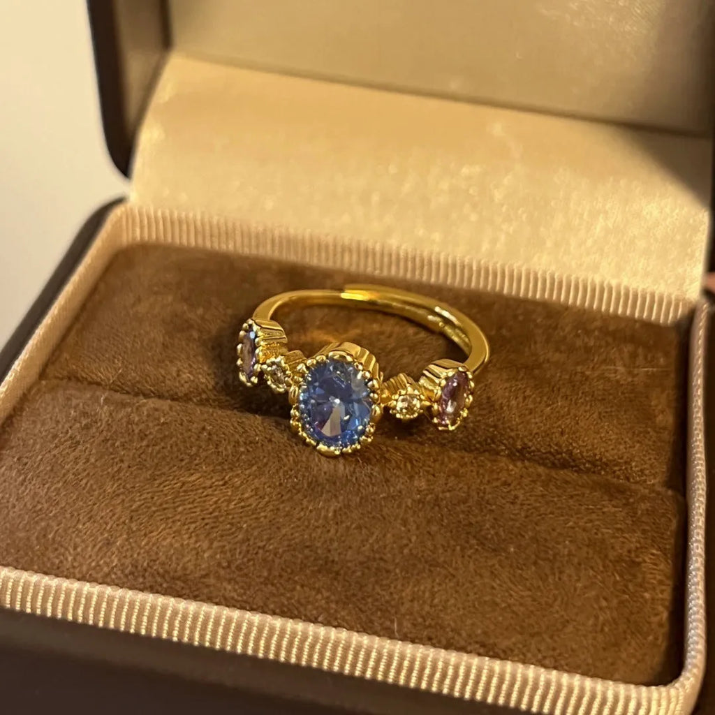 Vintage copper ring with blue gemstone and snowflake ice flower design