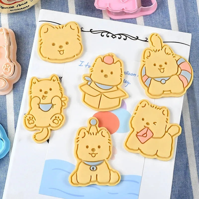 Plastic biscuit mould with puppy cartoon designs including birthday hats and swimming rings