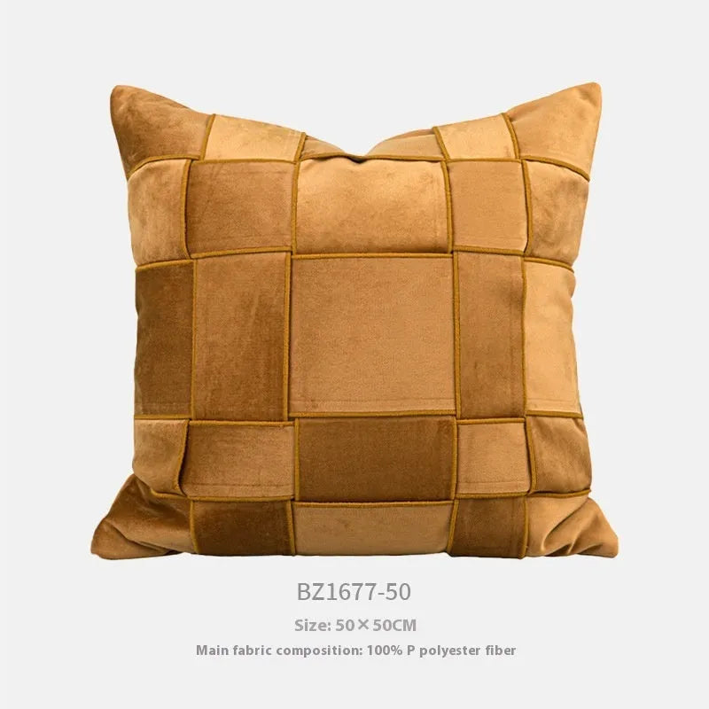 Square 50x50 cm chenille woven pillow cushion in beige colour on a grey sofa.
