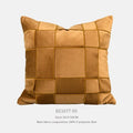 Square 50x50 cm chenille woven pillow cushion in beige colour on a grey sofa.
