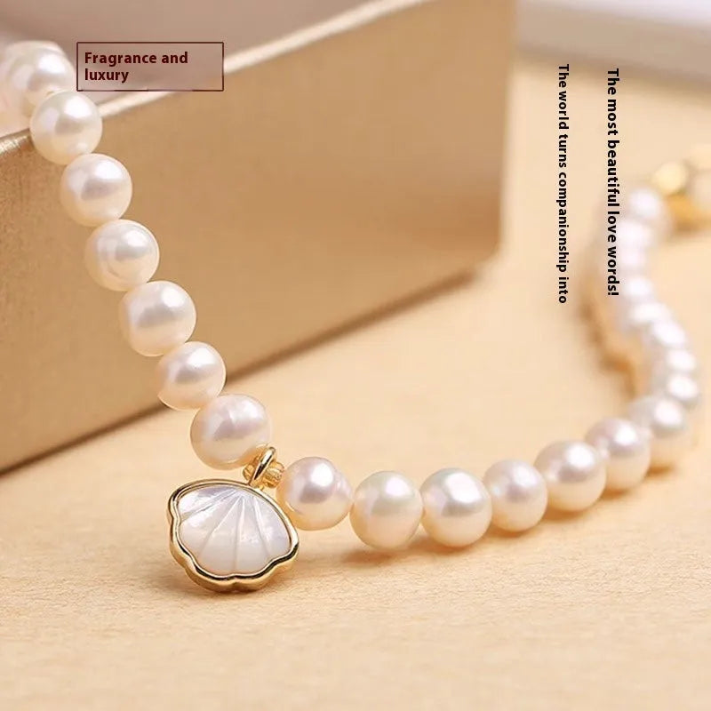 Women's freshwater pearl fan-shaped bracelet with elastic string or extension chain option, 16cm length.
