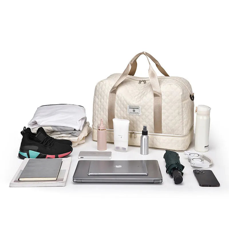Large grey and pink Oxford cloth leisure travel bag with sewing thread detail on a white background.