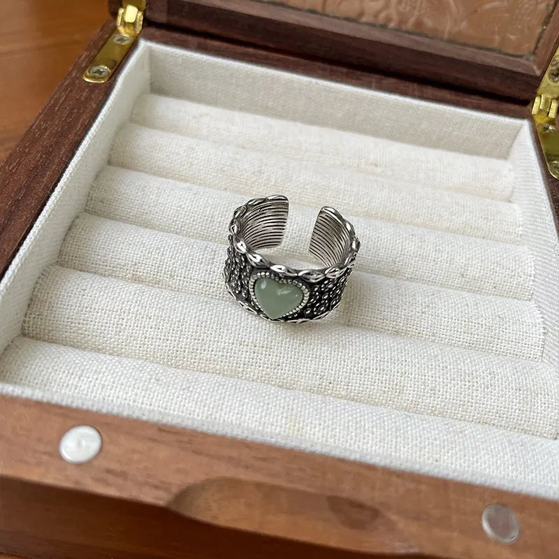 Retro wide-faced heart ring with adjustable opening in white copper plated silver
