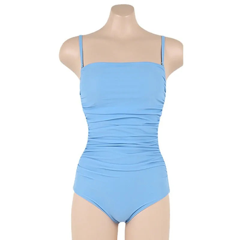 Women's blue sling style one-piece swimsuit with a belted pleated waist detail on a model.
