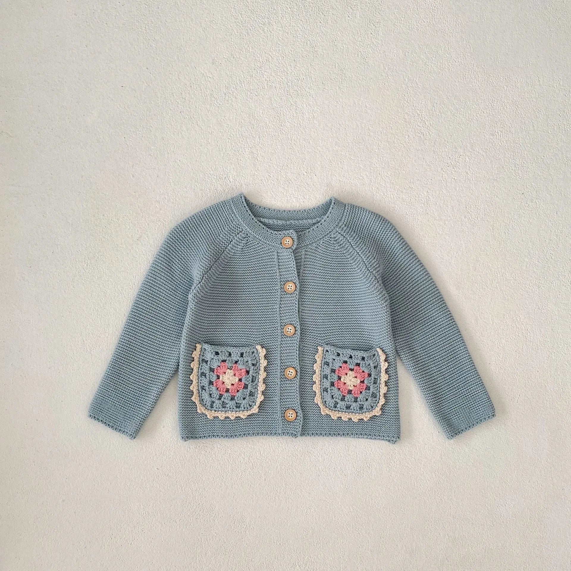 Children's hand crochet cotton cardigan in smokey blue with round collar and hollow flower pocket