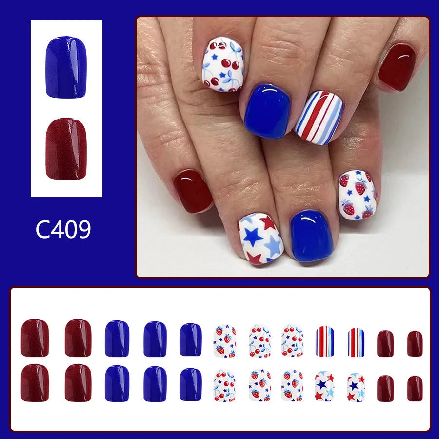 Short glossy red and blue nail stickers with strawberry and cherry patterns - 24 piece set